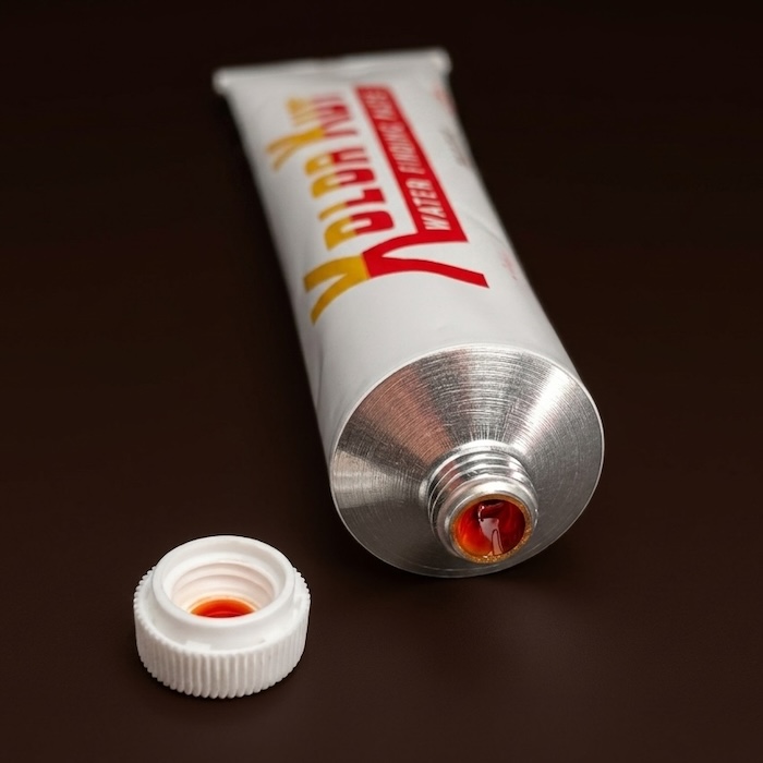 Genuine Kolor Kut Water Finding Paste tube with cap removed, showing no internal seal